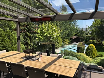 Heatscope Vision 3200W Radiant Heater trims a private residence patio ceiling, delivering silent infrared patio heating performance.